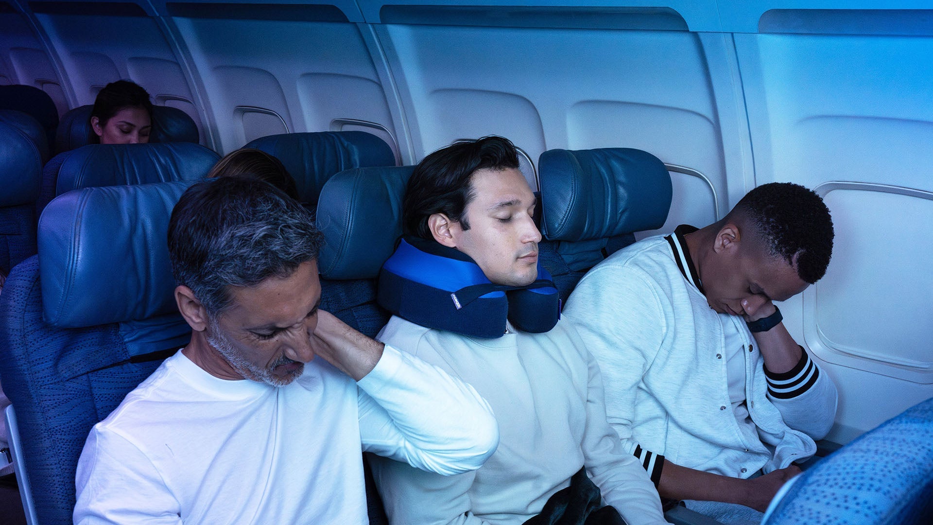 Person with Cabeau travel pillow sleeping. Travelers without pillow are in pain.