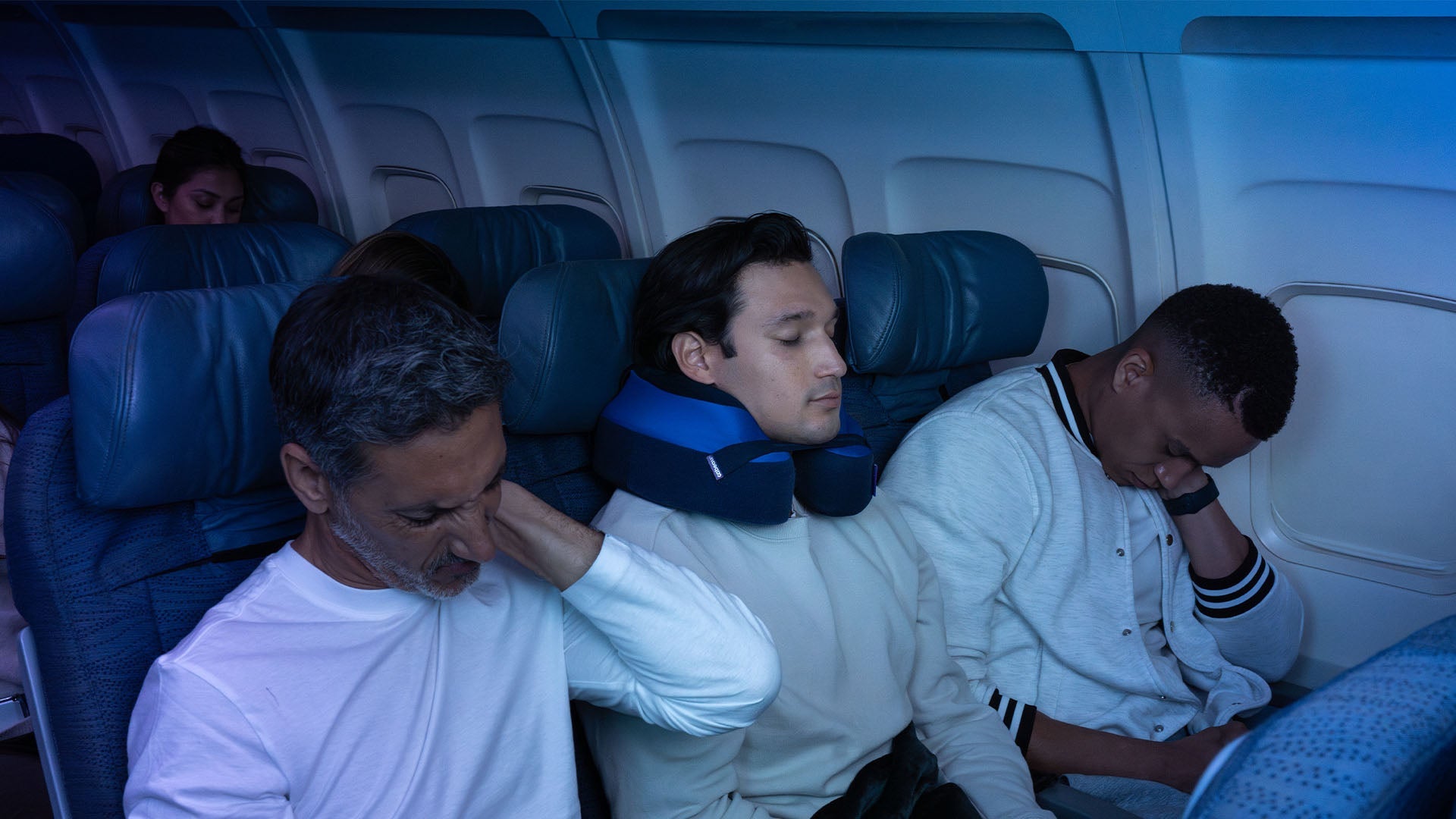 Person with Cabeau travel pillow sleeping. Travelers without pillow are in pain.