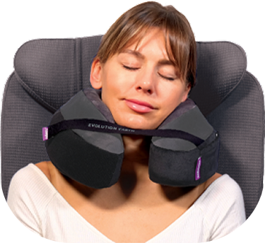 Woman using a Cabeau Evolution Earth Deluxe travel neck pillow 